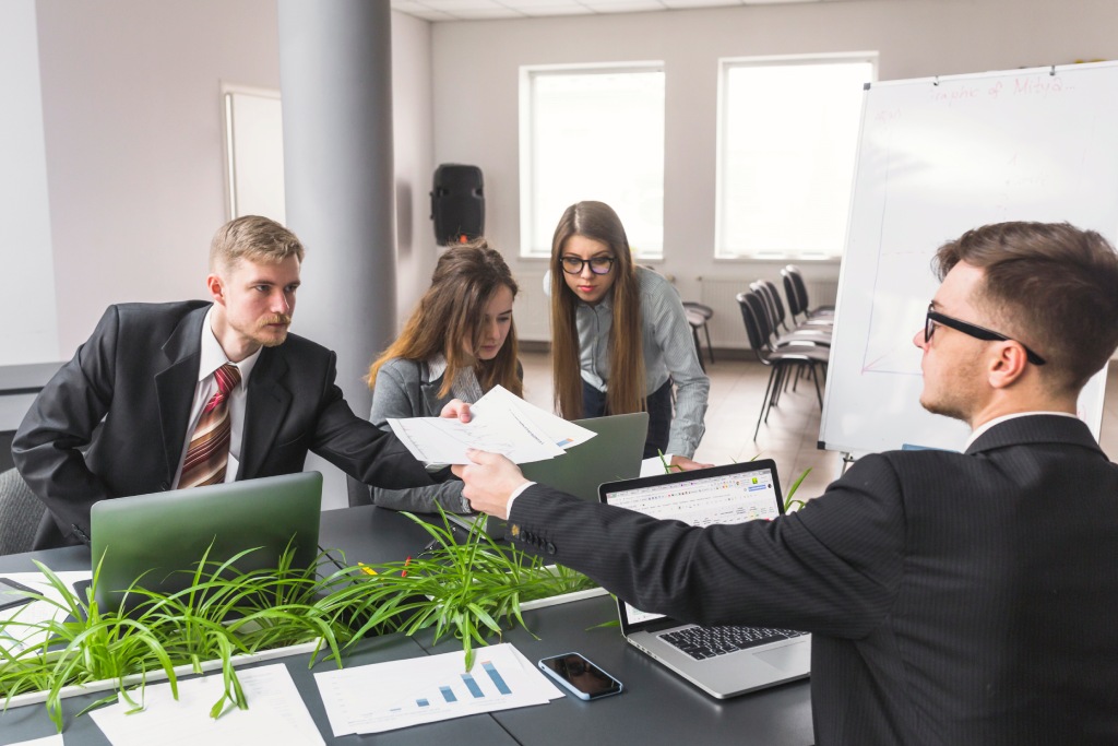 Hiring employees for an HOA with board members reviewing employment policies and legal requirements