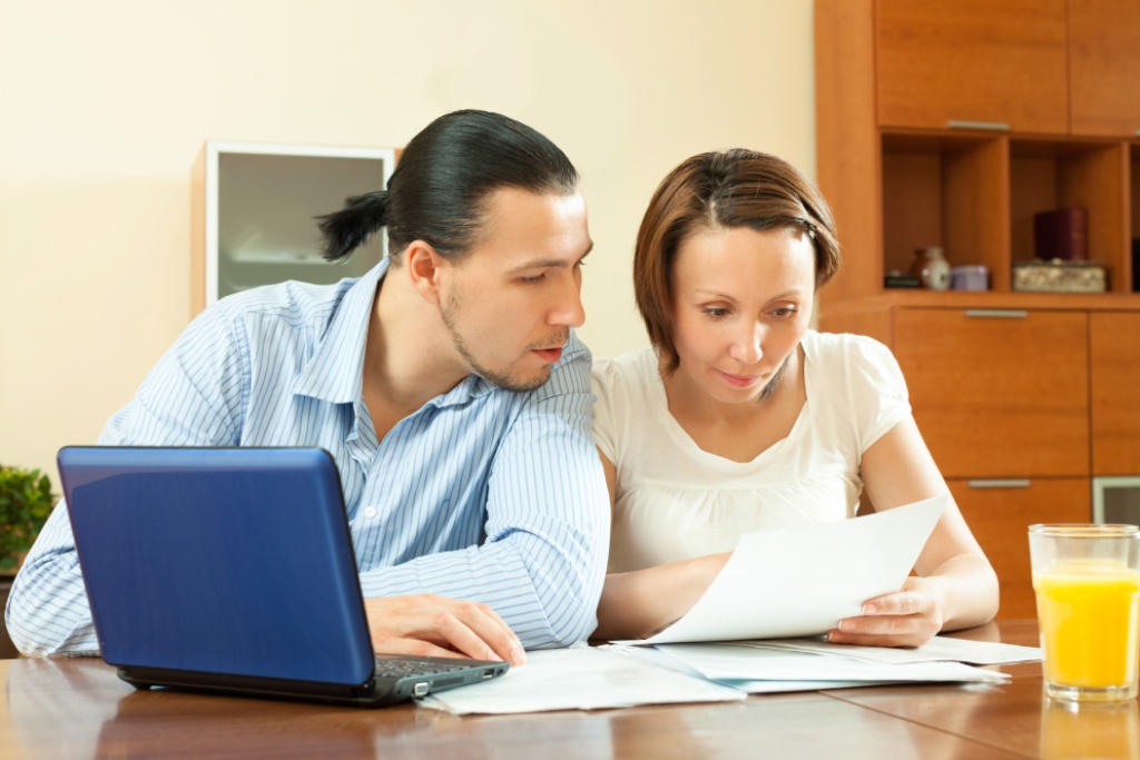 Homeowner reviewing HOA assessment notices, budgets, reserve records, and financial documents
