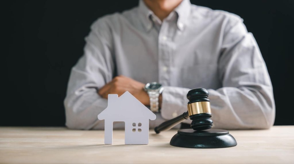 Homeowner consulting an HOA foreclosure defense attorney to prevent foreclosure proceedings.