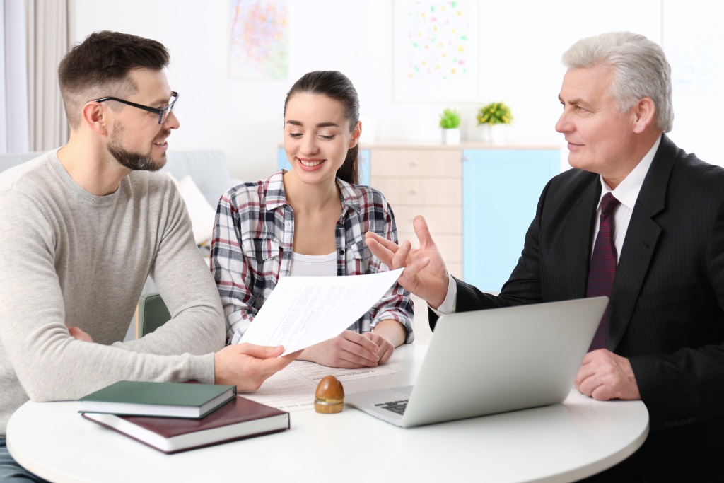 Homeowner reviewing HOA CC&R governing documents with community association attorney