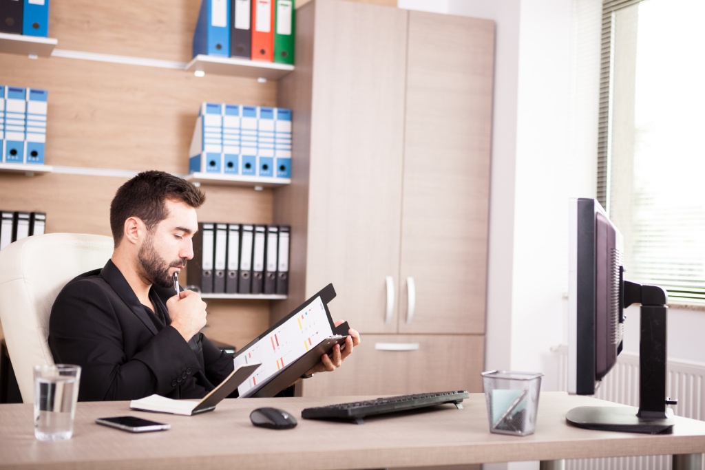 HOA litigation attorney reviewing legal documents for a homeowners association dispute