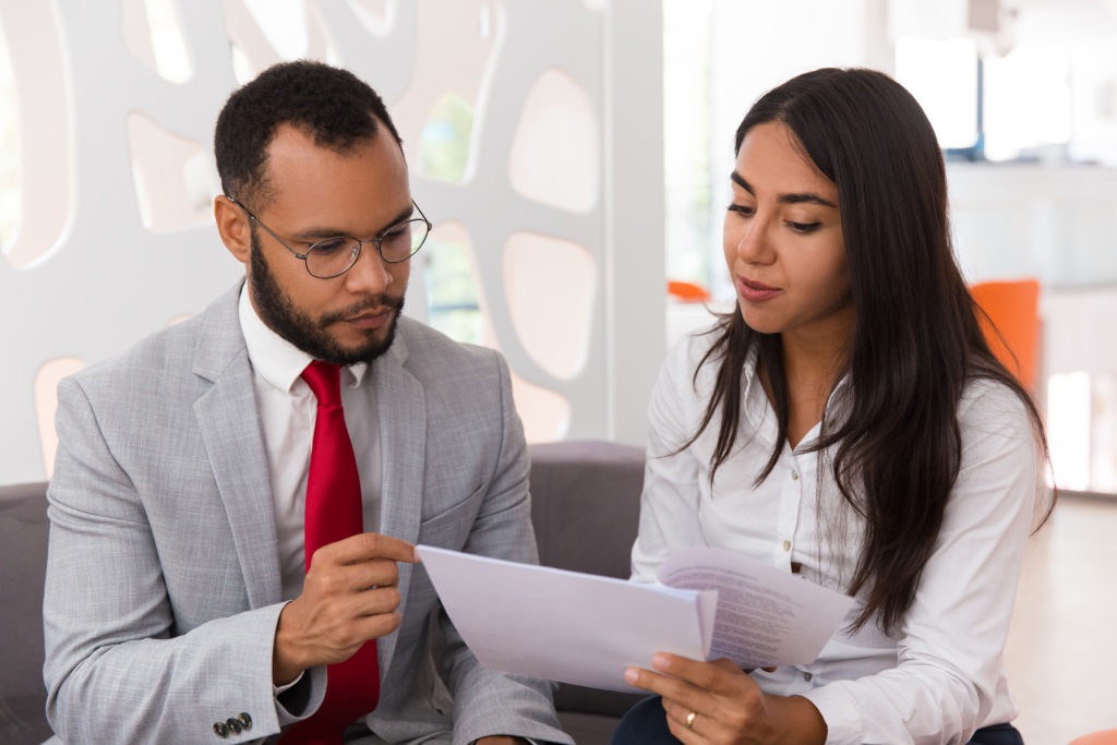 San Diego HOA attorney reviewing lawsuit documents, CC&Rs, notices, and evidence with a client