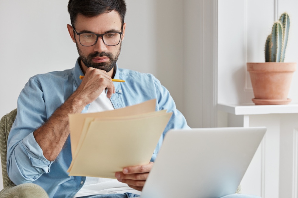 Homeowner receiving an HOA denial letter for a residential solar panel installation