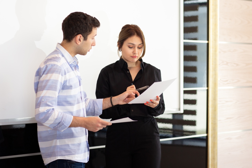 Tenant and landlord reviewing an HOA violation notice, illustrating whether an HOA can fine a tenant