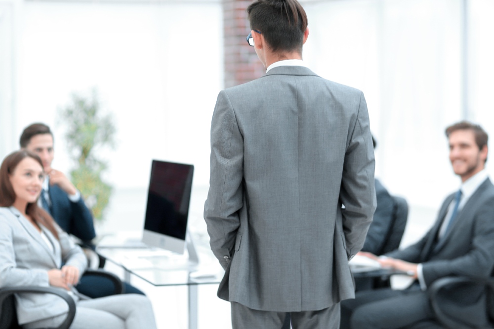 HOA board member stepping back from a vote at a board meeting, illustrating an HOA board conflict of interest