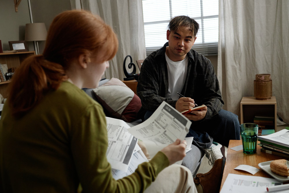 Homeowner reading an HOA violation notice, an example of HOA selective enforcement when neighbors are not cited