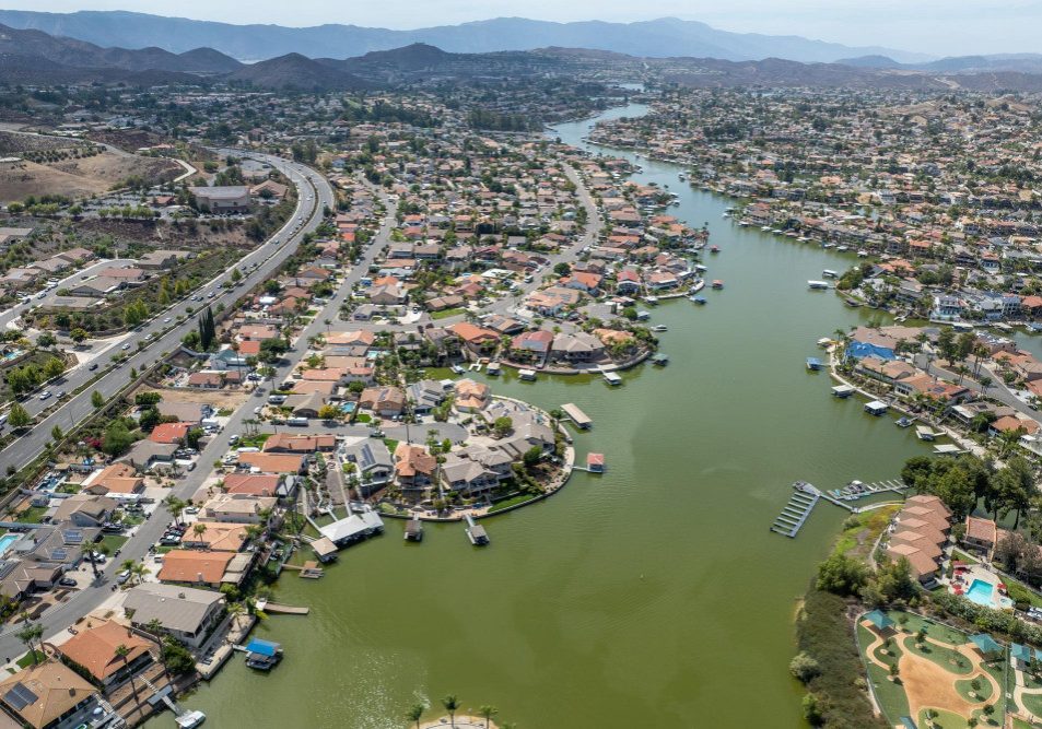 Aerial view of lake elsinore with sprawling neighborhood of family homes riverside county