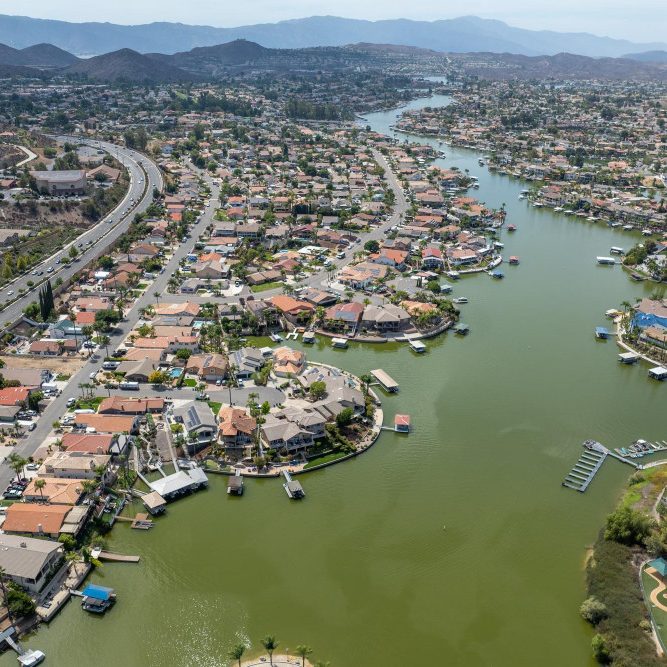 Aerial view of lake elsinore with sprawling neighborhood of family homes riverside county