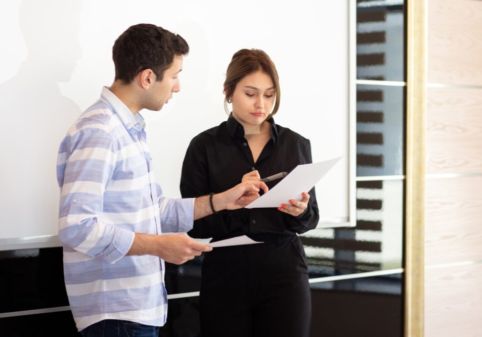Tenant and landlord reviewing an HOA violation notice, illustrating whether an HOA can fine a tenant