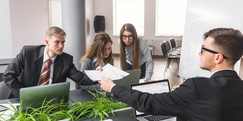 Hiring employees for an HOA with board members reviewing employment policies and legal requirements