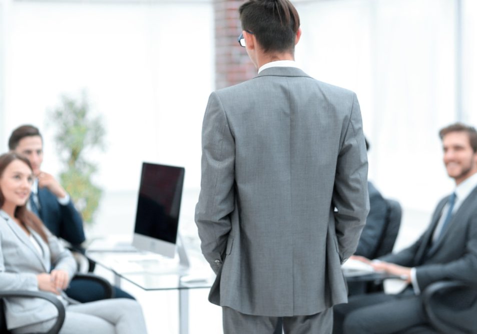 HOA board member stepping back from a vote at a board meeting, illustrating an HOA board conflict of interest