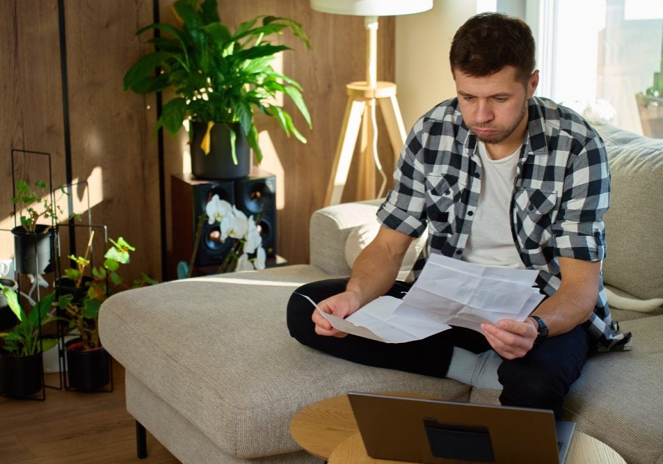 Homeowner reviewing an HOA budget report and notice of an HOA dues increase