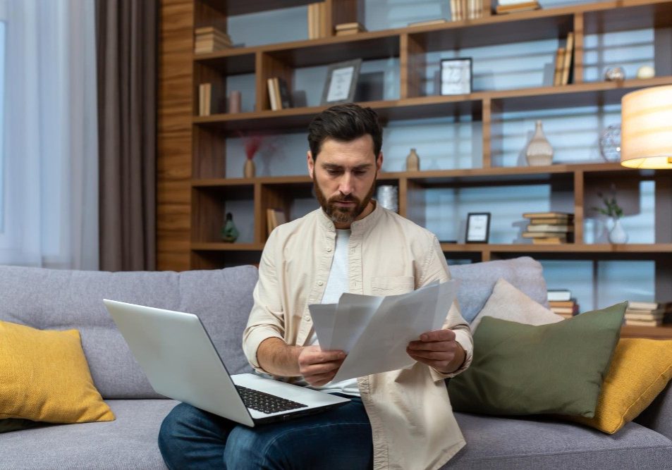 Homeowner reading a recorded HOA lien notice at home, illustrating what an HOA lien means