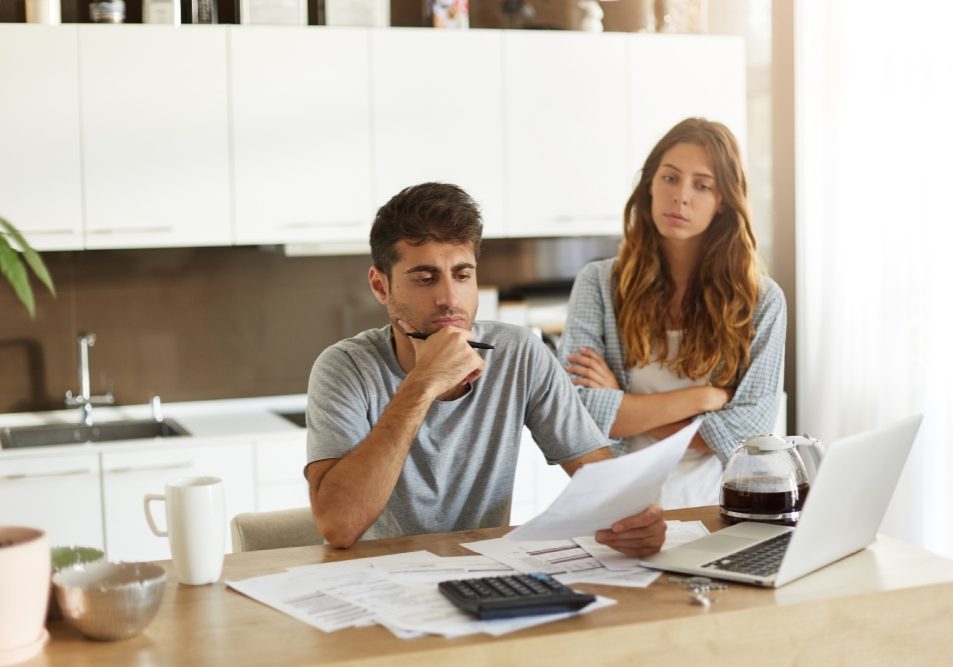 Homeowner reviewing HOA budget and bank statements for signs of misuse of funds